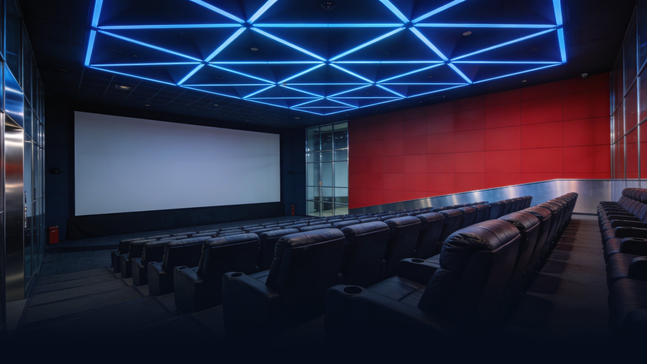 Empty modern Seoul corporate cinema interior at dusk with sleek modern auditorium, rows of empty large reclining seats in dark leather, geometric LED ceiling pattern in cool blue providing minimal ambient light